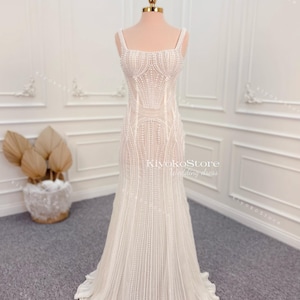 Beaded wedding dresses. Gorgeous bridal dresses. Pearl wedding dresses. Mermaid dresses. Strapless dresses.