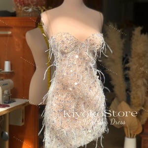 Short wedding dress with beads and feathers. Short wedding dress. Mini wedding dress. Prom dresses. Feather dress. Sexy corset dress.