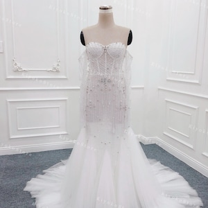 Beaded mermaid wedding dresses. Tulle wedding dresses. Custom bridal wedding dresses. Sparkle wedding dresses.