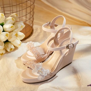 Wedding shoes with crystal flowers and chiffon butterflies. Elegant high heel wedding shoes.