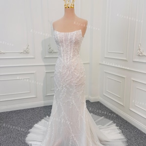 Mermaid wedding dresses. Beaded mermaid dresses. Luxury evening dresses. Sparkling wedding dresses. Custom wedding dresses.