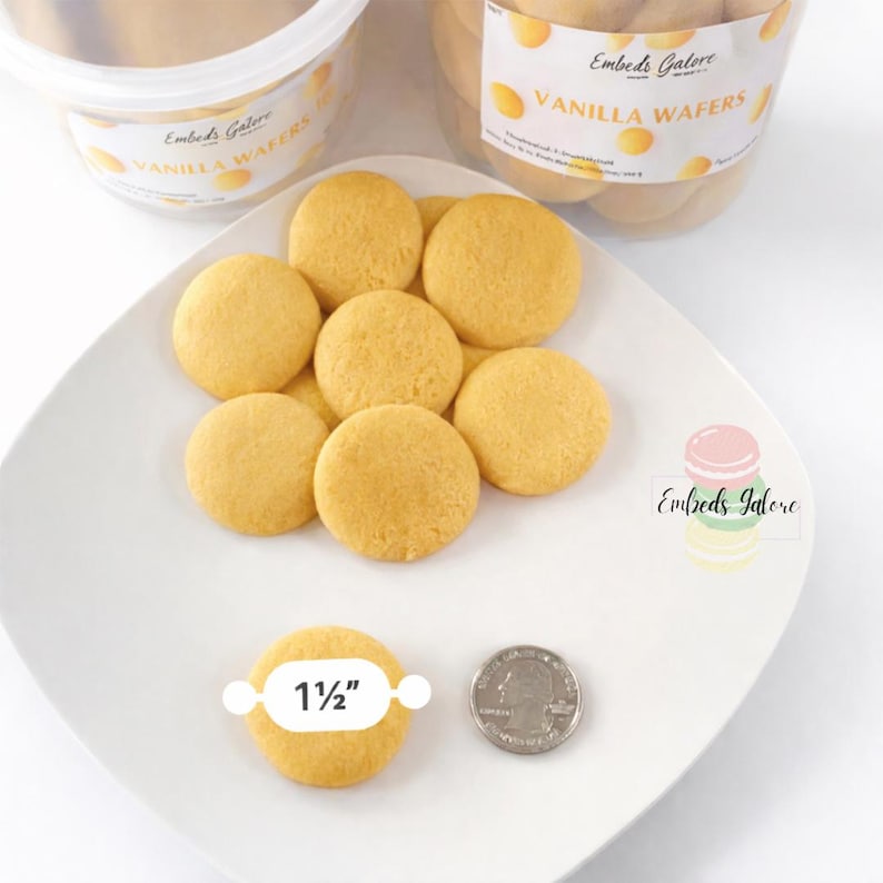 Vanilla wafer–shaped soy wax embeds arranged on a white plate with a 1½-inch size reference and U.S. quarter for scale, shown in front of labeled Vanilla Wafers containers on a clean white background.