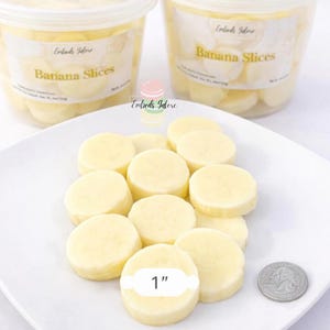 Banana slice wax embeds for candles and wax melts with 1 inch size reference.