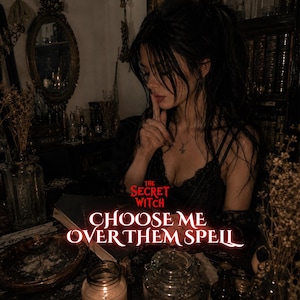 May include: A dark-themed graphic featuring a person with dark hair and a black lace top, with the red text "THE SECRET WITCH" and "CHOOSE ME OVER THEM SPELL" overlaid on a book, surrounded by candles, dried plants, and a mirror in a dimly lit room.
