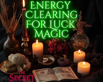 May include: A mystical arrangement featuring lit candles, dried flowers, and an open book with illustrations. The text "ENERGY CLEARING FOR LUCK MAGIC" glows in green. A small plate holds a seashell and biscuits. The logo "THE SECRET WITCH" is visible.