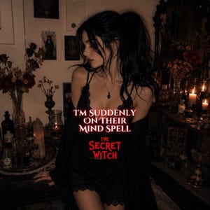 May include: A black lace-trimmed camisole with a black robe. The text reads: I'M SUDDENLY ON THEIR MIND SPELL THE SECRET WITCH. The garment features thin straps and delicate lace detailing along the neckline and hem, worn in a dimly lit room.