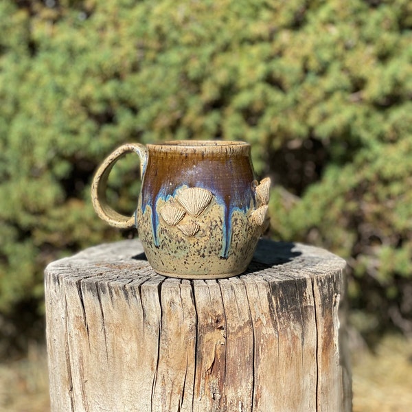 Handmade ceramic mug w/ mushrooms and drippy glaze that's dishwasher and microwave safe