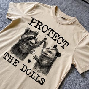 Protect The Dolls, Raccoon opossum Shirt, Equality Shirt, Meme T Shirt, Vintage Cartoon T Shirt, Aesthetic Tee, Unisex T-Shirt