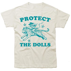 Protect The Dolls Shirt - Feminist T Shirt, Human Rights Shirt - 2000s Style Activist Slogan Tee, Feminism Cowgirl Riding Tiger Meme Shirt