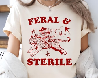 Feral And Sterile - Funny Feminist T-Shirt, Hell Cat Cowgirl Riding Tiger Meme, Funny Meme, Hysterectomy Shirt, 90s - 2000s Style T-Shirt