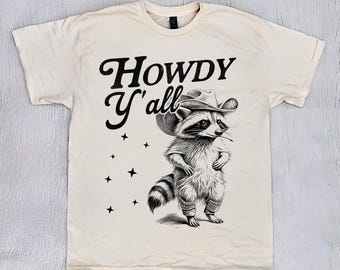 Camiseta Howdy Y'All, camiseta meme de cowboy e guaxinim, camiseta vintage de desenho animado, camiseta estranha, camiseta meme desequilibrada