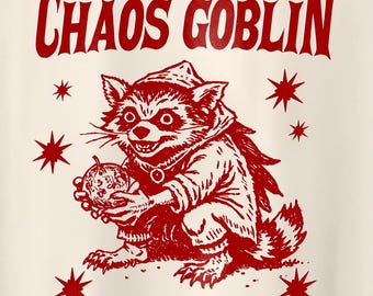May include: Red illustration of a raccoon wearing a hooded robe and holding a pumpkin. The text "CHAOS GOBLIN" is above the raccoon. There are red stars around the raccoon.
