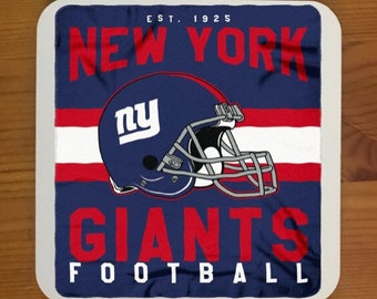 May include: A blue and red New York Giants football team logo with the team's name and the words "EST. 1925" and "FOOTBALL" on a white background.