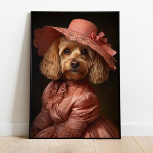 May include: A brown and white dog wearing a pink dress and a large pink hat with lace trim. The dog is looking directly at the camera.