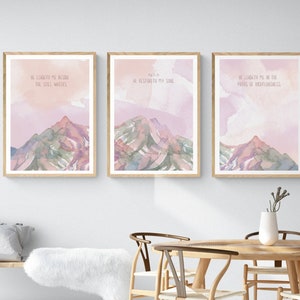 May include: Three watercolor prints with mountain scenes and inspirational quotes from Psalm 23. The quotes are "He leadeth me beside the still waters", "He restoreth my soul", and "He leadeth me in the paths of righteousness".