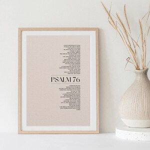 May include: A beige printable wall art print with a black and white text of Psalm 76. The text is in a serif font and is centered on the page. The background is a subtle beige color with a textured pattern.