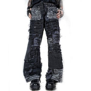 May include: A white ceramic mug with a black handle and the text "But First, Coffee" in a bold, black font. The mug is set against a blurred background, suggesting a cosy setting.