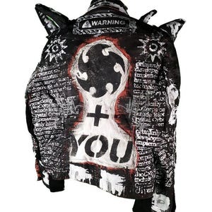 May include: Black denim jacket with white and red paint splatter and text. The text includes "WARNING" and "YOU".