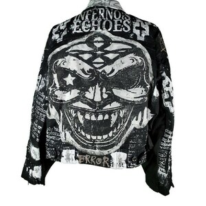 May include: Black denim jacket with a white graphic print of a scary face and the text "Infernos Echoes" and "Error".