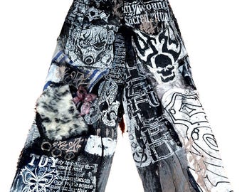 May include: Wide-leg pants with a patchwork design featuring skulls, text, and abstract patterns in black, white, and gray. The pants have a unique, artistic aesthetic, with visible text elements.