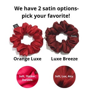May include: Two satin scrunchies with text reading We have 2 satin options-pick your favourite! The left is Orange Luxe with a tag reading Soft, Thicker, Durable. The right is Luxe Breeze with a tag reading confy and Soft, Lux, Airy.