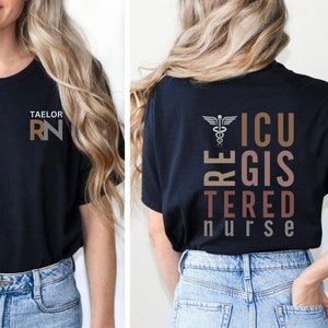 May include: Black t-shirt with the text "ICU Registered Nurse" in brown and pink lettering. The front of the shirt has the text "Taelor RN" in brown lettering.
