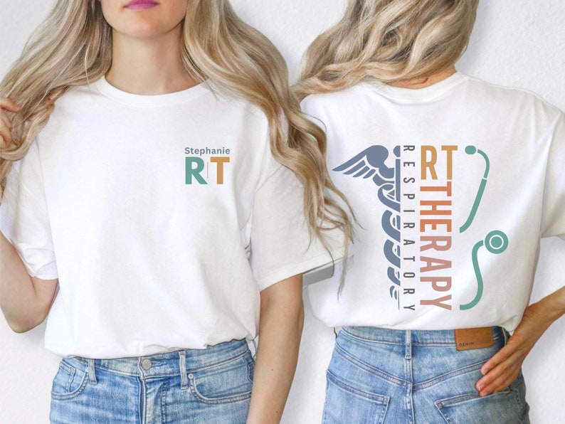 May include: White t-shirt with the text "Stephanie RT" on the front and a graphic of a caduceus with the text "RT THERAPY RESPIRATORY" on the back.