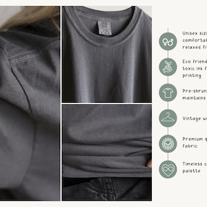May include: A close-up of a gray t-shirt with a crew neck. The shirt has a vintage worn-in look and is made of premium quality fabric. The image also highlights the shirt's unisex sizing, eco-friendly ink, and pre-shrunk design.