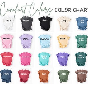May include: A color chart displays various t-shirt colors, including white, black, and blue jean. The text "Comfort Colors" and "COLOR CHART" are at the top. Other colors include blossom, orchid, and watermelon.