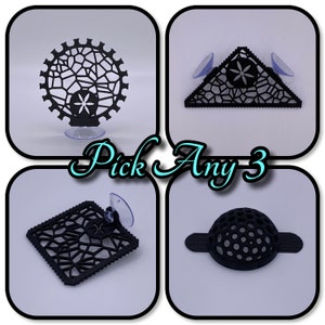 May include: Four black geometric suction cup holders with a variety of shapes and designs.  Pick Any 3.