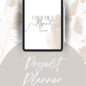 May include: A digital tablet displaying a crochet project planner with the text "CROCHET Project PLANNER" on the screen. The tablet is surrounded by pages from the planner, which are printed with a light brown watercolor design.