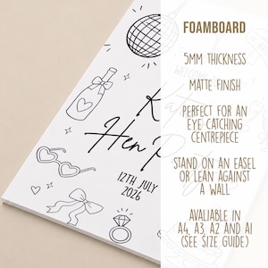 May include: White foam board with black line art illustrations and text. The design includes a disco ball, champagne bottle, heart-shaped sunglasses, a bow, and a diamond ring. Text reads "K Hen P 12th July 2026".