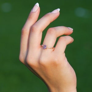 Vintage alexandrite diamond solid gold ring on the finger. Unique vintage color changing Alexandrite ring. Solid gold diamond engagement Ring, 8K Solid gold moissanite Ring. Ethical diamond dainty bridal ring on the finger, Tali Jewelry Ring