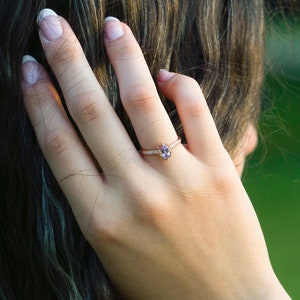 Vintage alexandrite diamond solid gold ring on the finger. Unique vintage color changing Alexandrite ring. Solid gold diamond engagement Ring, 8K Solid gold moissanite ring. Ethical diamond dainty bridal ring on the finger, Tali Jewelry Ring