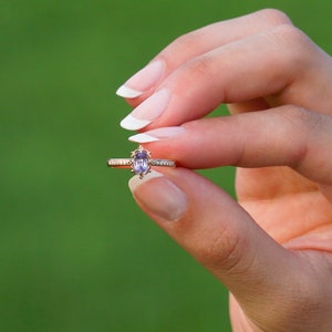 Vintage alexandrite diamond solid gold ring on the finger. Unique vintage color changing alexandrite ring. Solid gold diamond engagement Ring, 8K Solid gold Moissanite ring. Ethical diamond dainty bridal ring on the finger, Tali Jewelry Ring