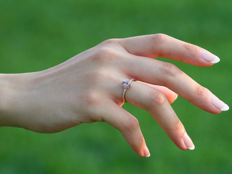 Vintage alexandrite diamond solid gold ring on the finger. Unique vintage color changing alexandrite ring. Solid gold diamond engagement Ring, 8K Solid gold Moissanite ring. Ethical diamond dainty bridal ring on the finger, Tali Jewelry Ring