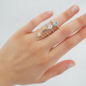 unique vintage diamond engagement ring with white topaz, alexandrite on the finger. Unique moissanite wedding ring with moonstone on the finger. Solid gold unique dainty engagement proposal ring with alexandrite on the finger. Tali Jewelry Rings