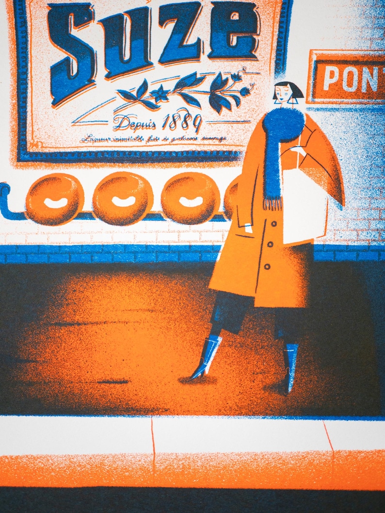 May include: A woman in a blue scarf and orange coat walks past a sign that reads "Suze" with the text "Depuis 1889" and "Liqueur inimitable faite de gentianes sauvages". Three orange circles are visible on the wall behind the sign.