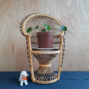 mini rattan chair plant stand | retro child's doll sized wicker peacock chair, with attractive black detailing | dual purpose 1970s treasure