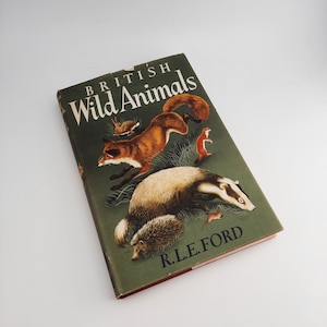 May include: A hardback book titled "British Wild Animals" with a green cover. The cover illustration shows a fox, badger, hedgehog, and other wildlife. The author's name, R.L.E. Ford, is printed on the cover.