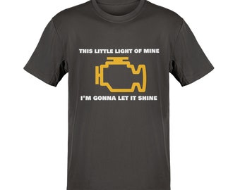 May include: Dark grey t-shirt with white text that reads "This little light of mine I'm gonna let it shine". A yellow check engine light icon is between the two lines of text.
