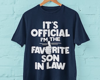 Funny T Shirt It&#39;s Official I&#39;m The Favourite Son In Law with big thumbs up covering letters joke gift for son in law husband new dad