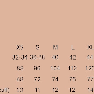 May include: Size chart for clothing with measurements in inches and centimeters. The chart shows sizes from XS to 6XL with corresponding chest measurements, length, and sleeve length.