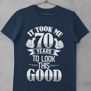 Funny 70th Birthday T Shirt It Took Me 70 Years To Look This Good in sizes small through 6xl with pointing thumbs design