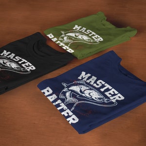 May include: Three folded crew neck t-shirts in black, olive green, and navy blue. Each shirt features a white graphic print of a fish on a fishing line with the text "MASTER BAITER" in a distressed, bold, capitalized font across the chest.