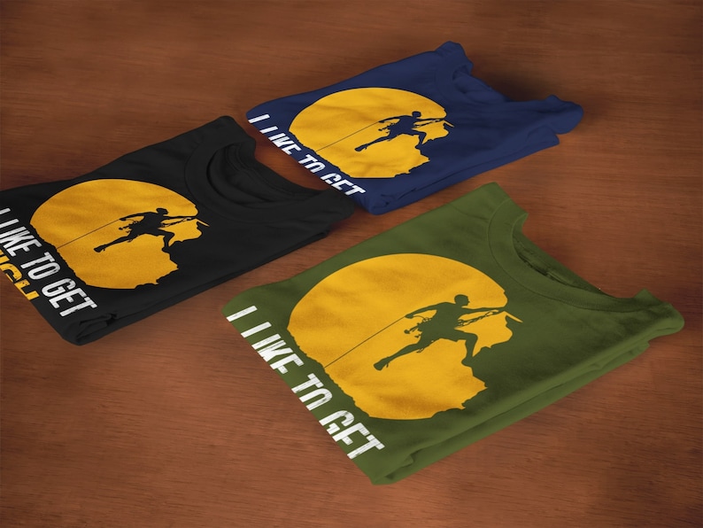 May include: Three folded t-shirts with a graphic of a person rock climbing on a yellow sun. The text on the shirts reads "I like to get high". The shirts are black, navy blue, and army green.