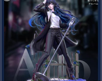 May include: A detailed figurine of a character in a black suit, white shirt, and long black coat, holding a microphone. The figure has long blue hair and is standing on a stage with blue roses. The text "Ado" and Japanese characters are visible.