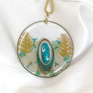 Long ethnic necklace with handcrafted pendant embellished with turquoise stone, blue, turquoise, green and gold leaf pressed real flowers