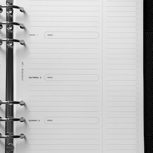 May include: A white planner refill page with a silver six-ring metal binder mechanism. The page features daily sections for Thursday 31, Friday 1, Saturday 2, and Sunday 3, with memo boxes, lined writing areas, and a vertical to do list column.