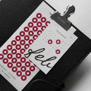 May include: A white sticker sheet with 60 burgundy circular stickers, featuring the text "BURGUNDY - 60 STICKERS" and "MY ROADMAP". A small calendar card for February 2027 is clipped to the sheet with a silver metal clip labeled "form & flow".